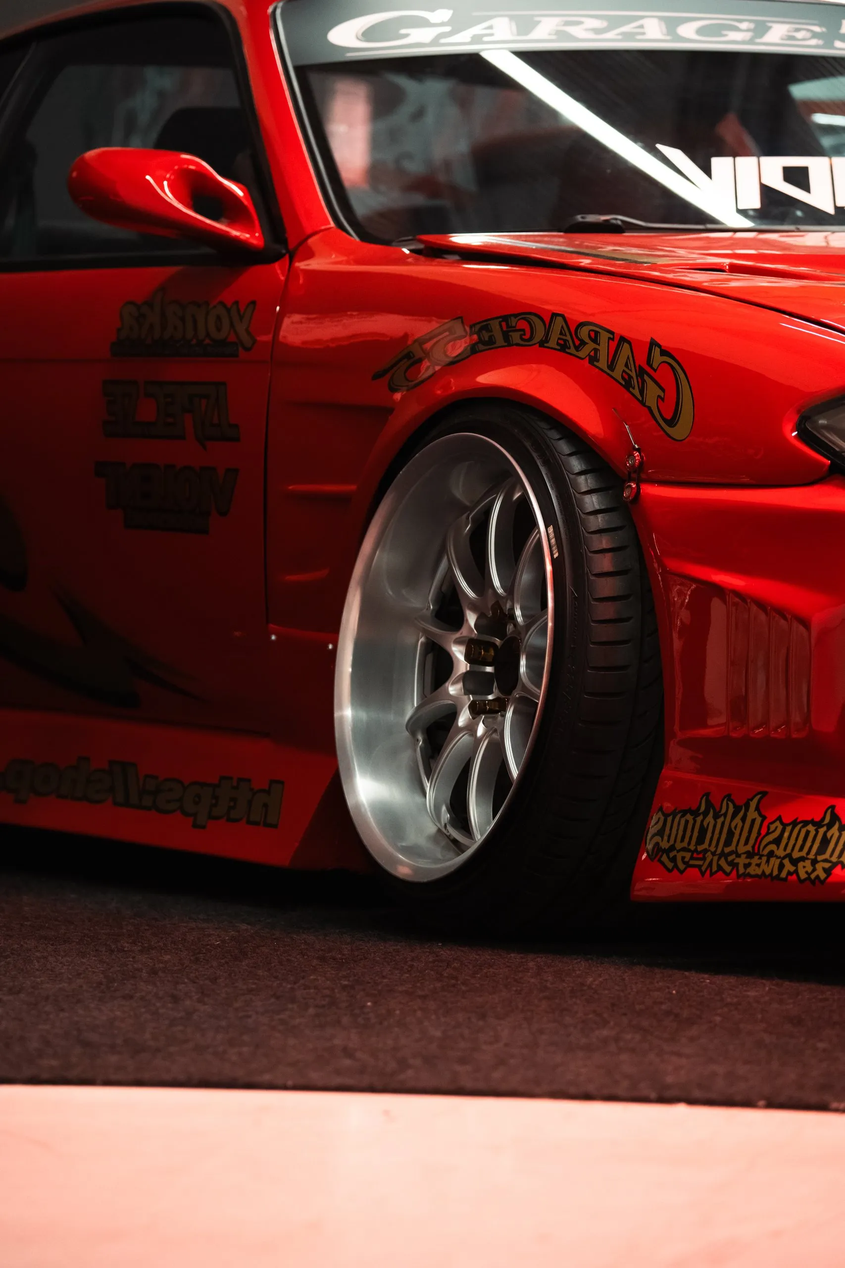 Red drift car on polished wheels