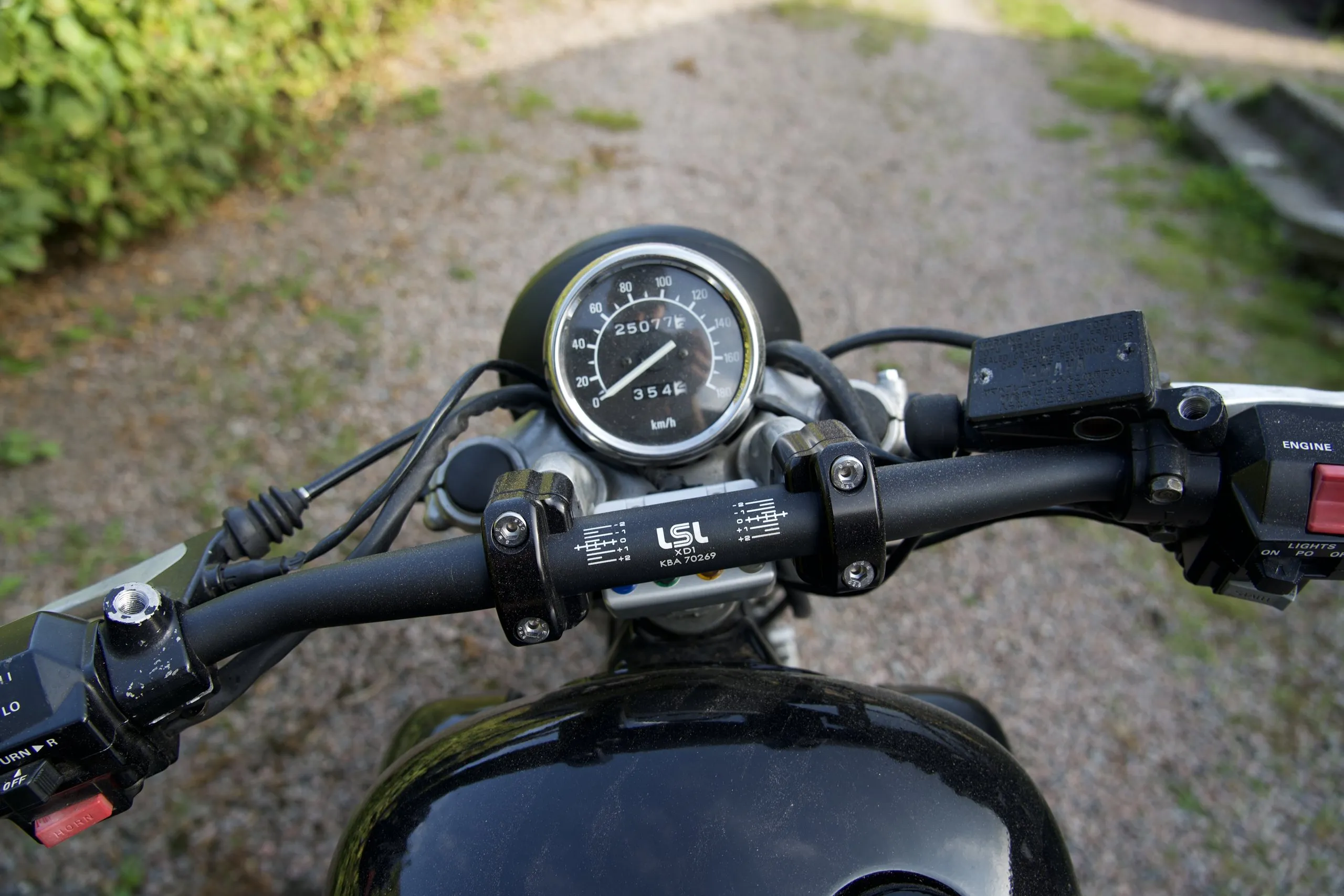 Round speedometer and bars on a custom bobber